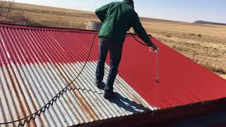 Airlessspray painting a roof [upl. by Eniamrej]