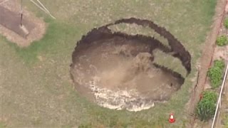 Giant Sinkhole Opens in Backyard [upl. by Hellman730]